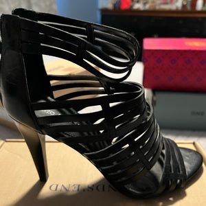 Enzo Angiolina size 7 black leather caged heel.